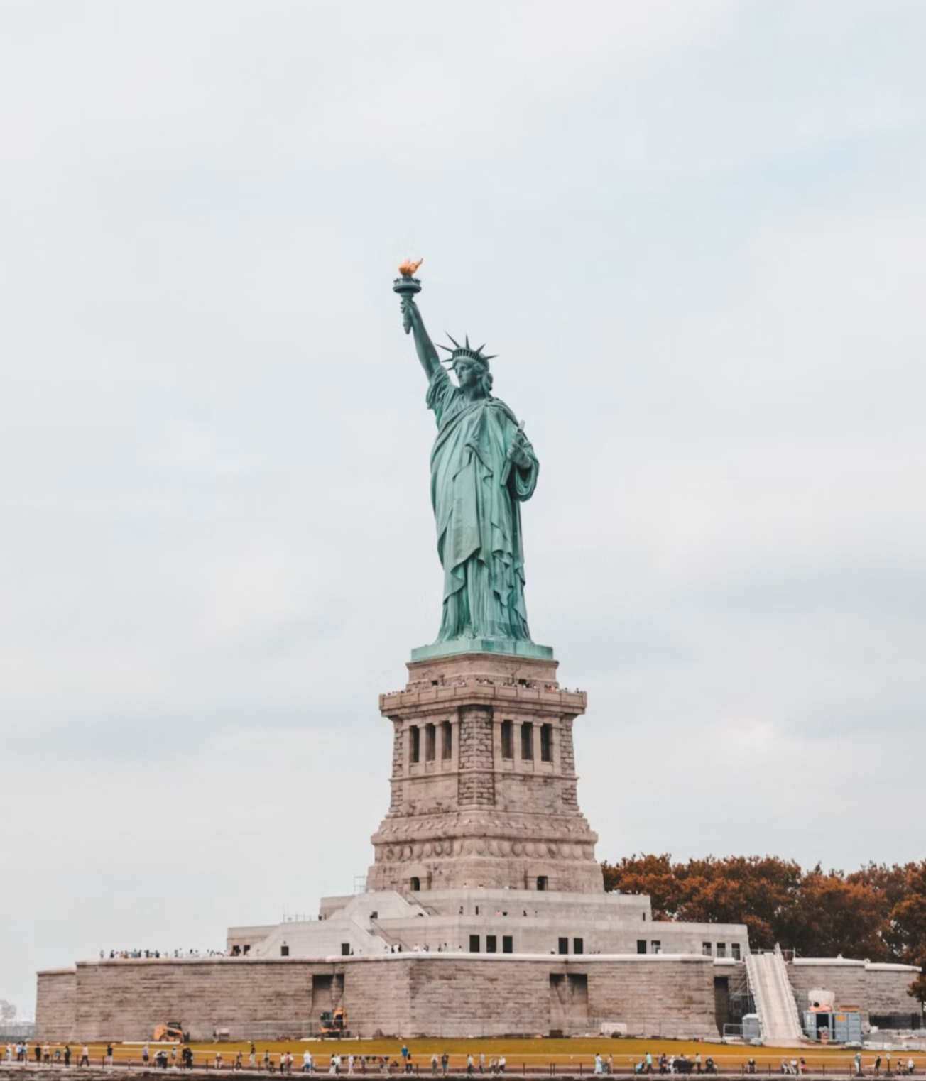The Statue of Liberty seen from the water on an overcast day